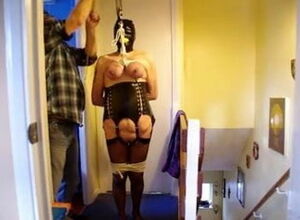 Gagged together with blindfolded hoisted